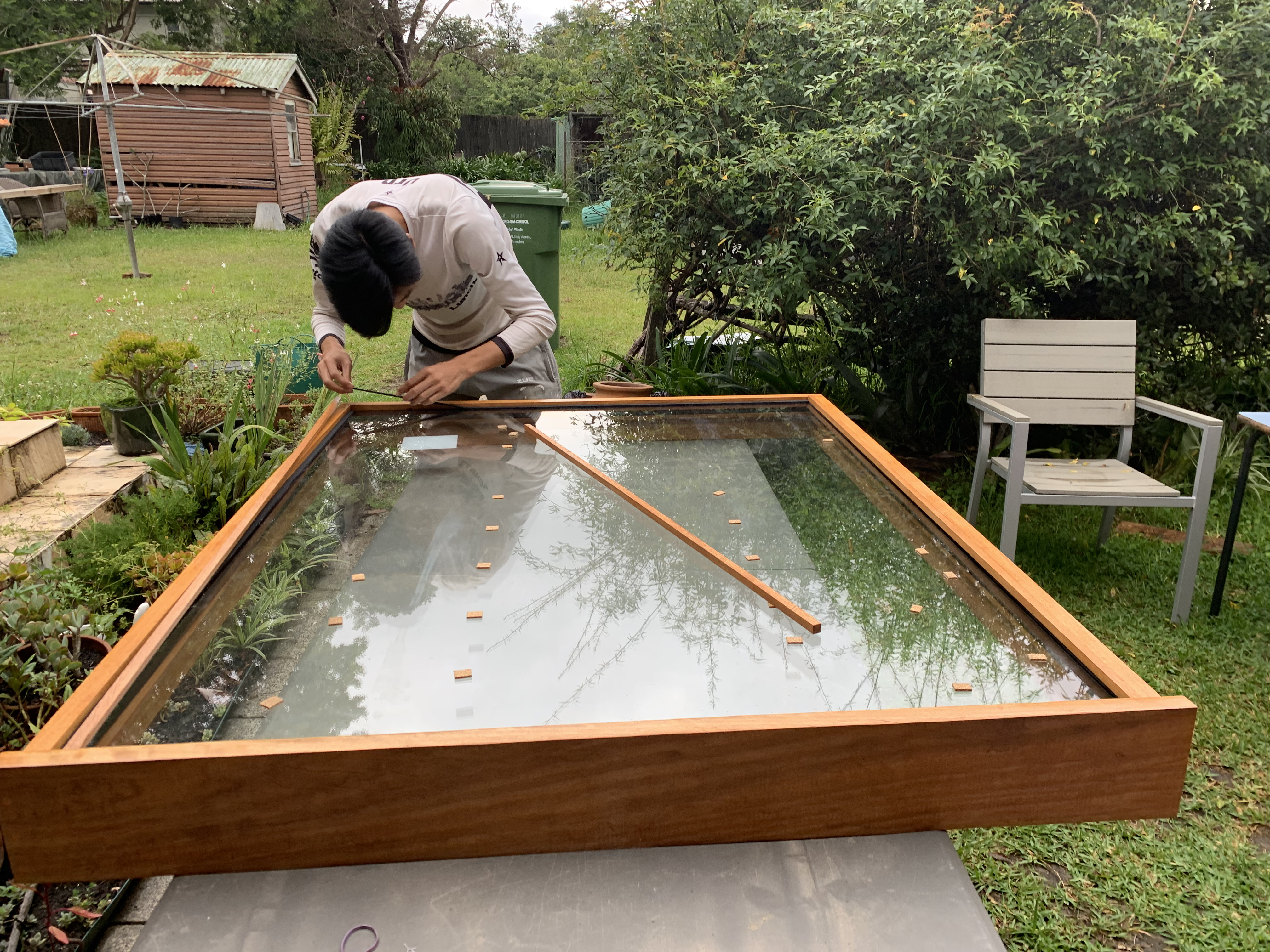 Racing against the rain and daylight to finish our picture window