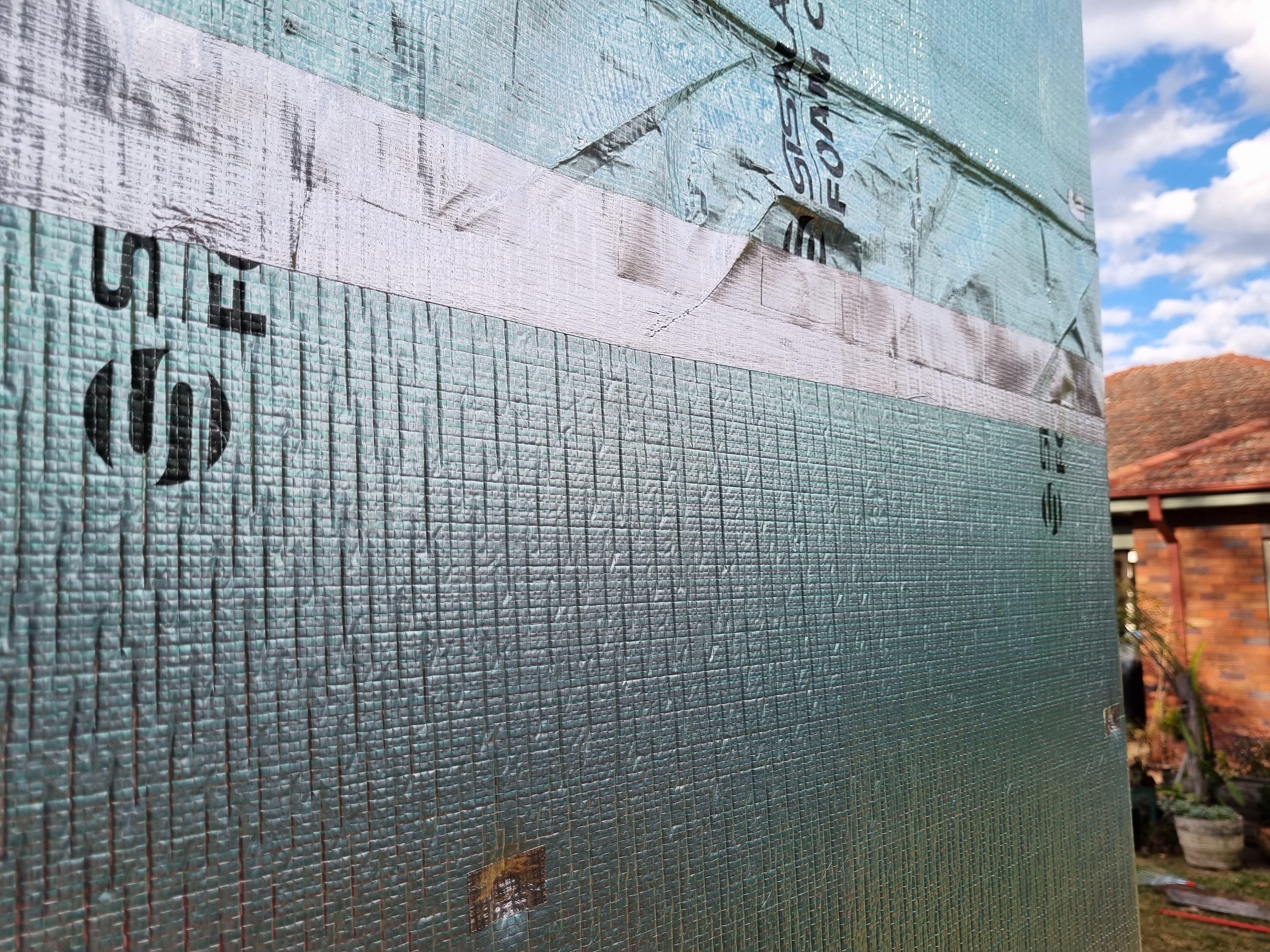 Taping the edges to prevent water coming through