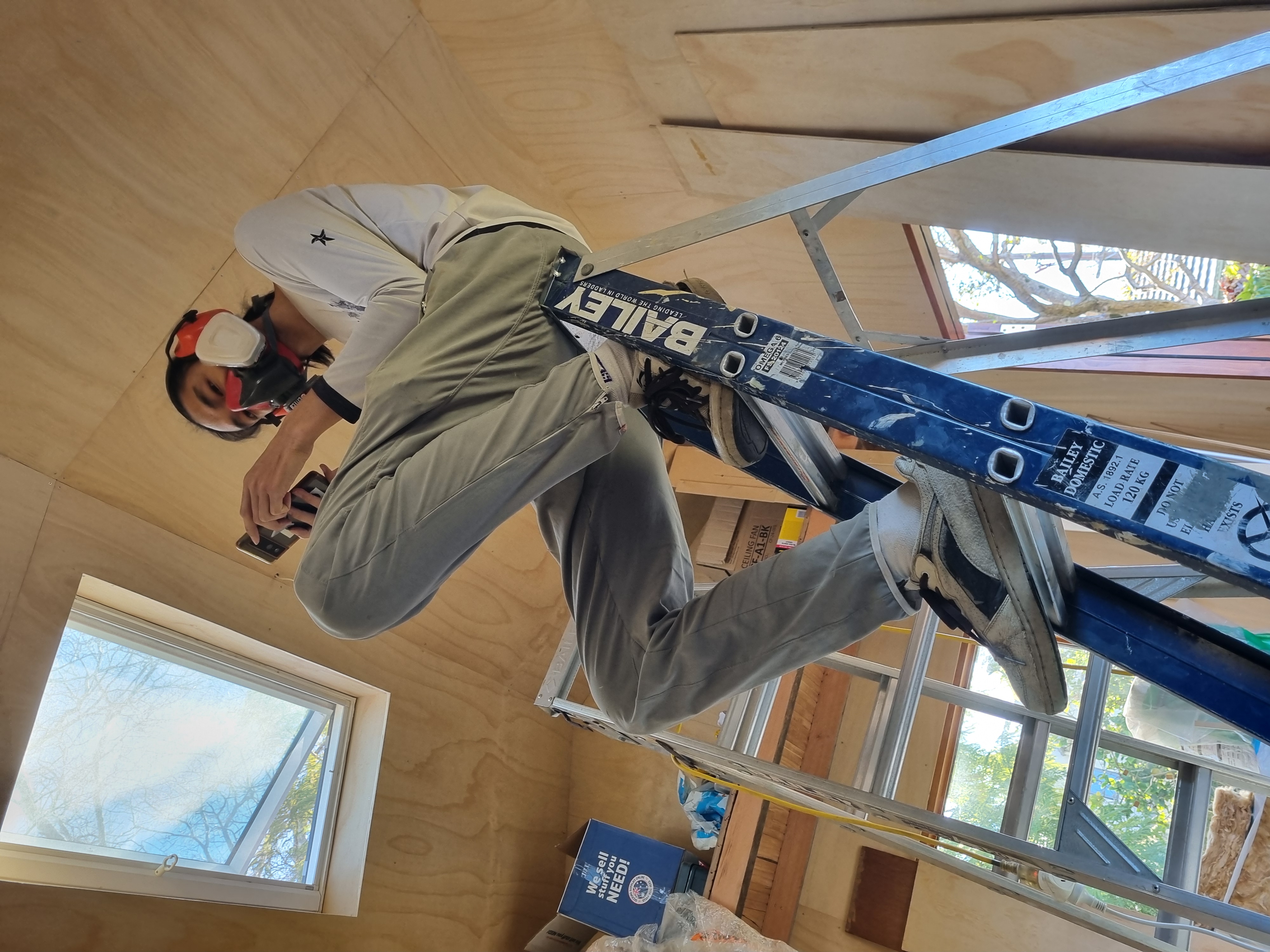 Erny oiling the ceiling